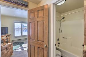 een deur naar een badkamer met een toilet bij Walk to Marina Rustic Grand Lake Retreat! in Grand Lake +30 foto's