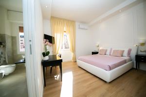 A bed or beds in a room at Viale Italia Boutique Rooms