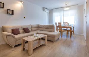 a living room with a couch and a table at Beautiful Apartment In Fazana With Kitchen in Fažana