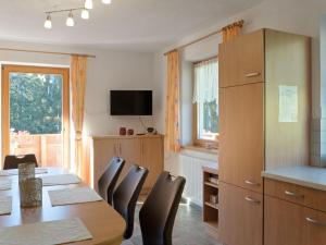 a dining room with a table and chairs at Lovely Apartment with Terrace in F genberg in Fügen