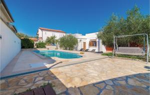 a swimming pool with a goal in a house at Stunning Home In Jezera With 2 Bedrooms, Wifi And Outdoor Swimming Pool in Jezera