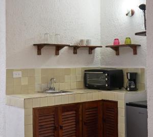 Kuchyň nebo kuchyňský kout v ubytování Maison Tulum
