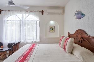 Postel nebo postele na pokoji v ubytování Maison Tulum