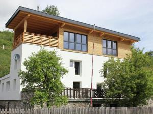 a house with a wooden roof at Spacious Holiday Home in Wenns near Ski Area in Wenns