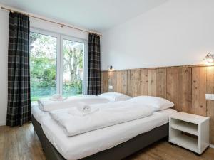 Ein Bett oder Betten in einem Zimmer der Unterkunft Luxurious Apartment in Zell am See near Ski Area