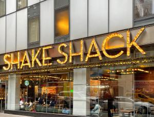 a large sign for a shaq store on a building at InterContinental New York Times Square by IHG in New York