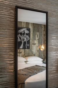 Postel nebo postele na pokoji v ubytování The FIDI Hotel