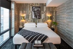 Postel nebo postele na pokoji v ubytování The FIDI Hotel