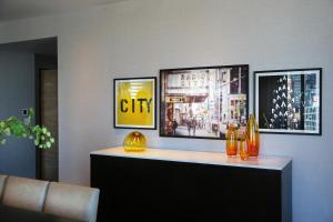 a counter in a room with three pictures on the wall at InterContinental New York Times Square by IHG in New York