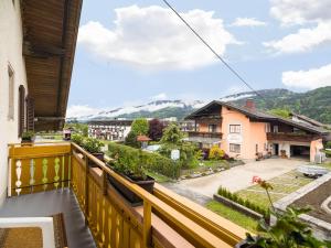 a balcony with a view of a town at Beautiful apartment with swimming pool in Tröpolach