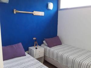Una cama o camas en una habitación de Punta vacaciones