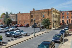a city street with cars parked in a parking lot at The Sanctuary Company Johnson City in Johnson City