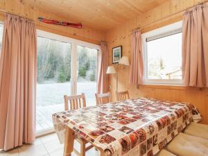 a dining room with a table and a window at Chalet in Stadl an der Mur Styria with terrace in Stadl an der Mur