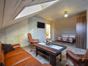 a living room with a couch and a table at Willa Laskosia in Murzasichle