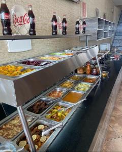 a buffet line with many different types of food at Pousada e Restaurante Manah in Propriá