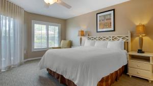 a bedroom with a large white bed and a window at Bluegreen Vacations Orlando's Sunshine, Ascend Collection Resort in Orlando +82 photos