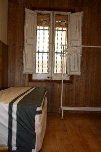 Postel nebo postele na pokoji v ubytování Cal Gaitero