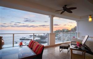 a living room with a view of the ocean at Hyatt Vacation Club at Sirena del Mar in Cabo San Lucas