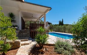 a house with a swimming pool in a yard at Stunning Home In Vela Luka With Outdoor Swimming Pool in Vela Luka