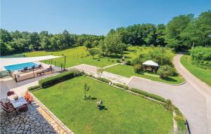 an aerial view of a garden with a picnic table at Beautiful Home In Nedescina With Outdoor Swimming Pool in Santalezi