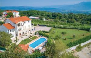 an aerial view of a house with a swimming pool at Gorgeous Home In Labin-krsan With Wifi in Kršan