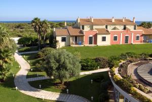 an aerial view of a house with a garden at Grupotel Playa Club in Son Xoriguer