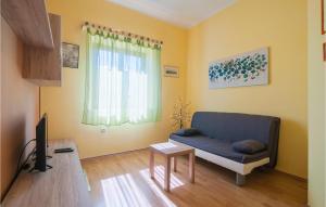 Televízia a/alebo spoločenská miestnosť v ubytovaní Holiday Home Omiska I