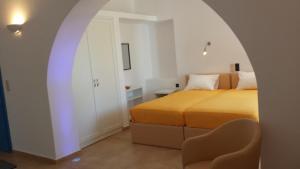 Ein Bett oder Betten in einem Zimmer der Unterkunft Epinio