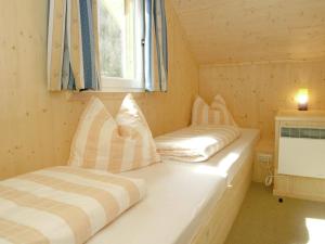 Posteľ alebo postele v izbe v ubytovaní Chalet in Stadl an der Mur Styria with sauna + 30 fotografií