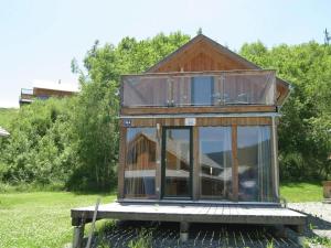 a house with a glass roof on a platform at Chalet in Stadl an der Mur Styria with sauna in Stadl an der Mur