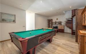 a pool table in the middle of a living room at Beautiful Home In Klenovica With 7 Bedrooms And Wifi in Klenovica