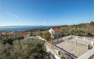 a view of the ocean from the roof of a house at Beautiful Home In Klenovica With 7 Bedrooms And Wifi in Klenovica