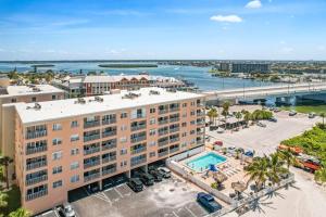 an aerial view of a building with a swimming pool at 310 Beach Place Condos in St. Pete Beach