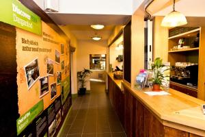 a restaurant with a long hallway with a counter at YHA Snowdon Pen-y-Pass in Llanberis