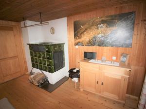 a kitchen with a stove and a sink in a room at Cosy Holiday Home in Egg near Ski Area in Egg