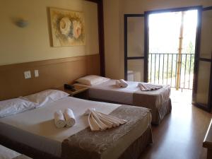 Postel nebo postele na pokoji v ubytování Hotel Vilage Inn All Inclusive Poços de Caldas By Nacional Inn + 61 fotografií