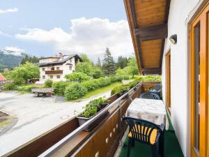 a balcony with a table and chairs and a view at Apartment in Tr polach Carinthia with pool in Tröpolach