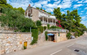 a house on the side of a hill at Cozy Apartment In Blato With Kitchen in Prizba