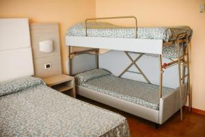 Postel nebo postele na pokoji v ubytování Hotel Costa Verde