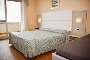 Postel nebo postele na pokoji v ubytování Hotel Costa Verde