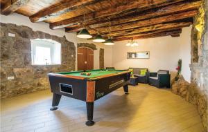 a room with a pool table in a building at Beautiful Home In Medveja in Medveja