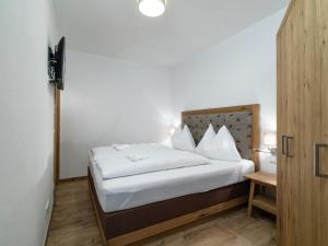 Posteľ alebo postele v izbe v ubytovaní Apartment Alpendorf near Ski Slopes + 26 fotografií