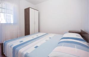 Posteľ alebo postele v izbe v ubytovaní Two-Bedroom Apartment In Vodice + 9 fotografií
