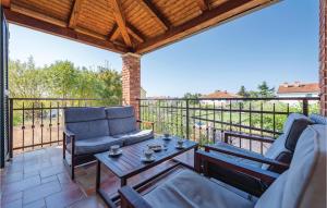 a patio with two chairs and a table at 3 Bedroom Stunning Home In Lovrecica in Lovrečica