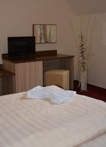 Voodi või voodid majutusasutuse Hotel Koruna toas
