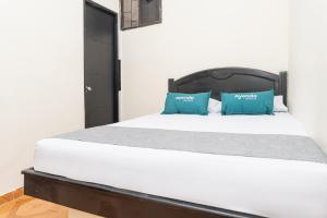 Rúm í herbergi á Hotel Itaka