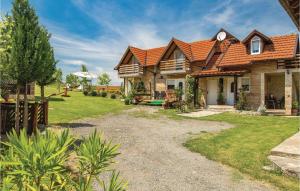 a house with an orange roof at Nice Home In Licko Lesce With Wifi in Ličko Lešće