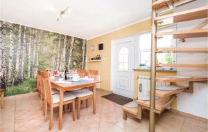 a dining room with a table and chairs at 2 Bedroom Cozy Home In Licko Lesce in Ličko Lešće