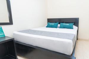 Uma cama ou camas num quarto em Ayenda Itaka