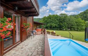 The swimming pool at or close to Cozy Home In Blazevci With Sauna